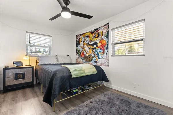 a bed room with a bed and a window