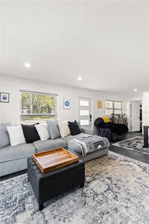 a living room with furniture a couch and dresser