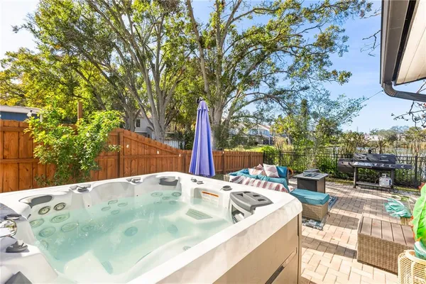 a view of a swimming pool with a patio