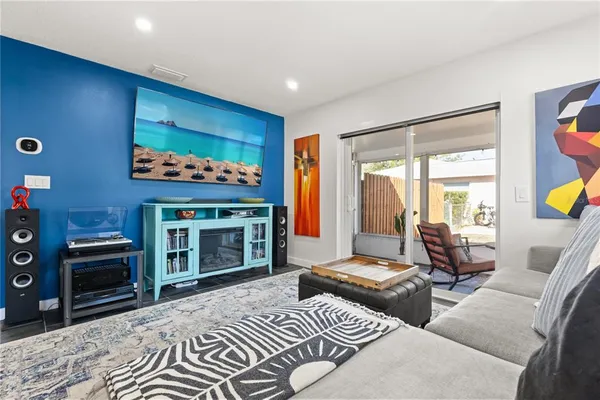 a bedroom with furniture and a fireplace