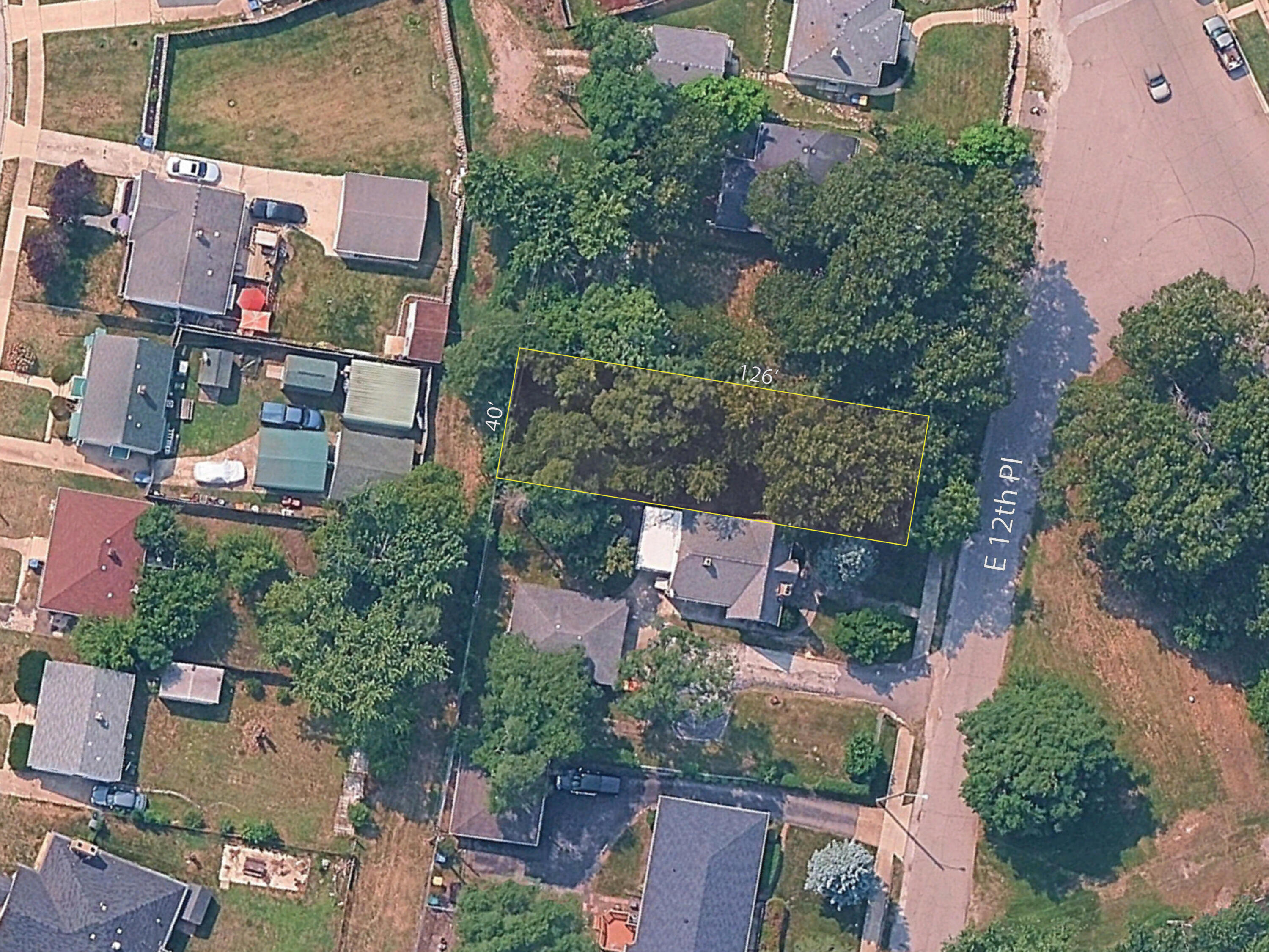3701 East 12th Place Gary, IN 46403 - Photo 1 of 7 an aerial view of residential houses with outdoor space and street view