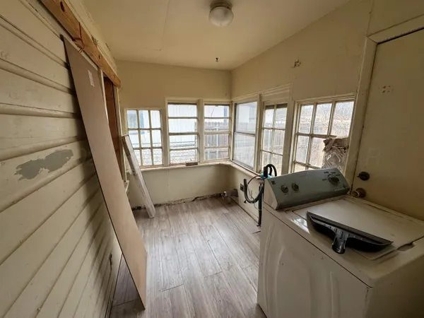 a living room with furniture and a gate