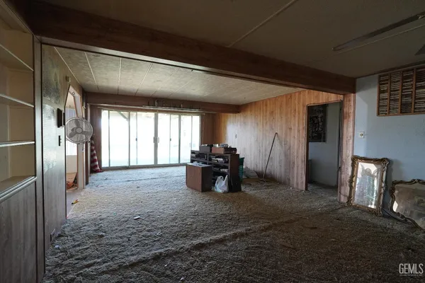 a kitchen with refrigerator and window