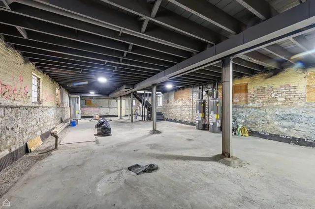 a view of empty room with wooden ceiling