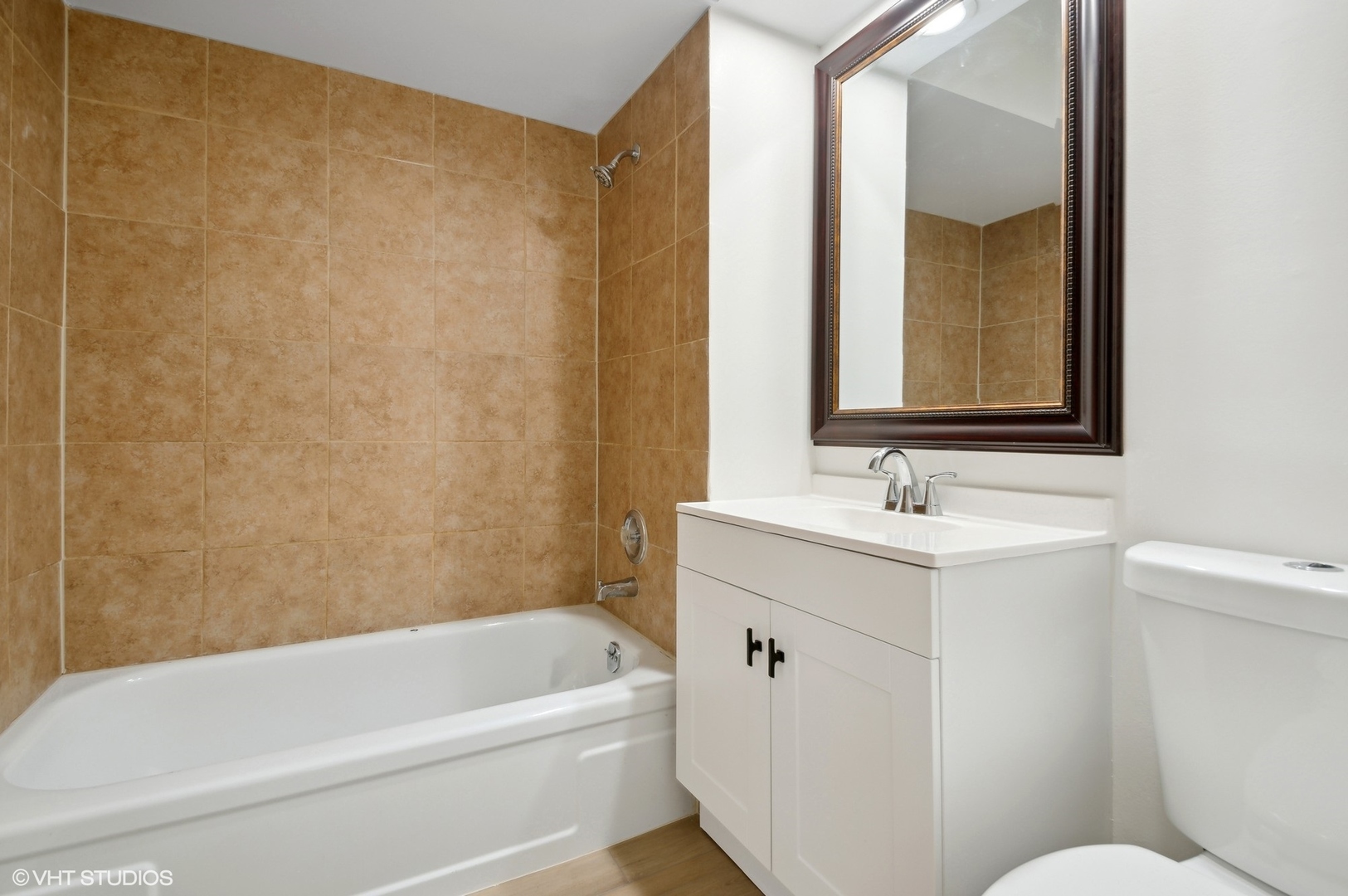 2300 West Algonquin Road, Unit 6 Rolling Meadows, IL 60008 - Photo 15 of 17 a bathroom with a sink a toilet and a bathtub