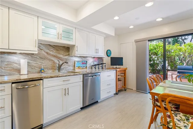 a patio with a yard table and chairs