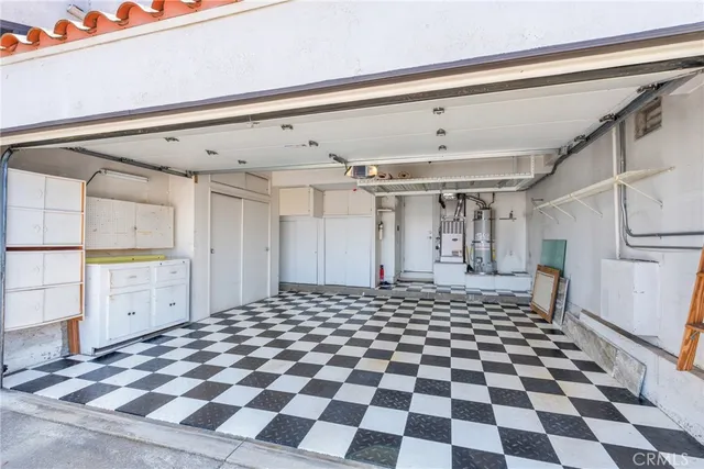 a view of a house with yard and sitting area