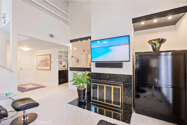 a kitchen with stainless steel appliances kitchen island granite countertop a refrigerator and a stove top oven