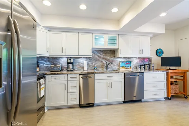 a dining room with furniture and a floor to ceiling window