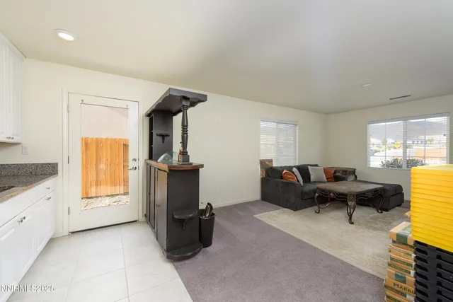a living room with furniture windows and a fireplace