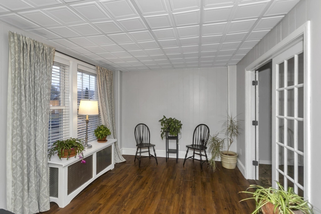 231 Wheatland Avenue Chicopee, MA 01020 - Photo 13 of 36 a living room with furniture and a wooden floor