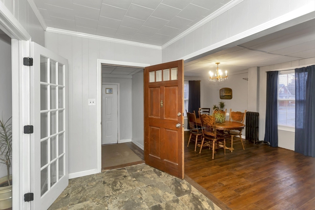 231 Wheatland Avenue Chicopee, MA 01020 - Photo 14 of 36 a view of a livingroom with furniture a dinning table and chairs