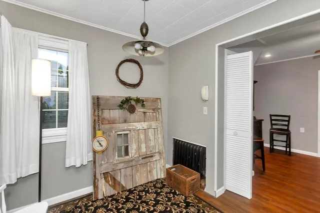 a view of a livingroom with furniture and wooden floor