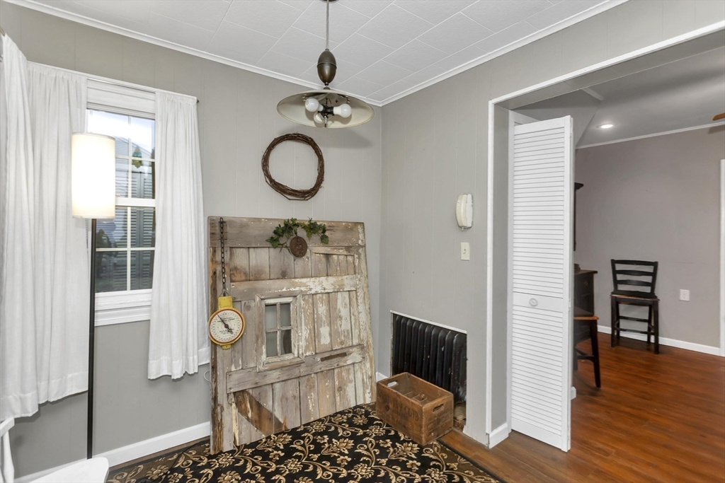 231 Wheatland Avenue Chicopee, MA 01020 - Photo 16 of 36 a view of a livingroom with furniture and wooden floor