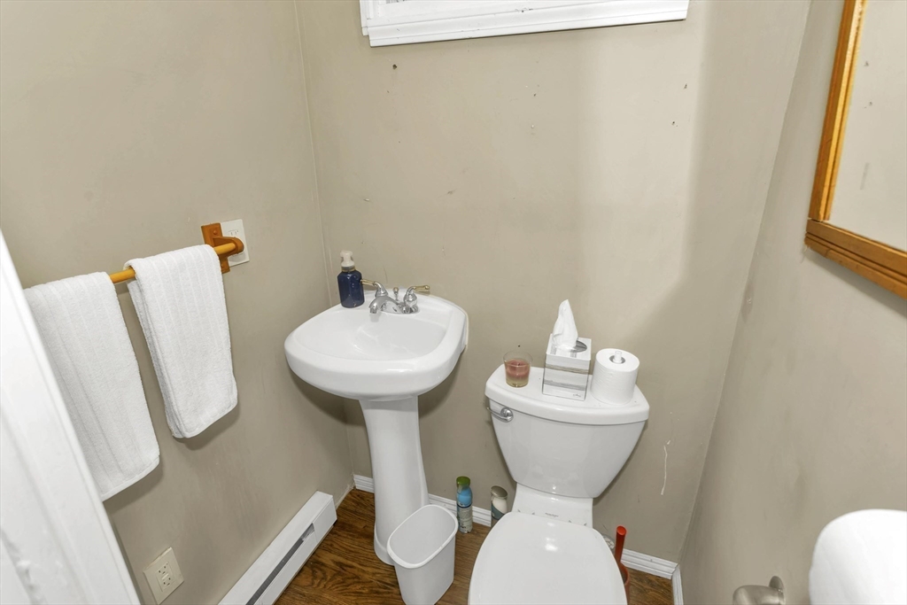 231 Wheatland Avenue Chicopee, MA 01020 - Photo 18 of 36 a bathroom with a sink mirror and toilet