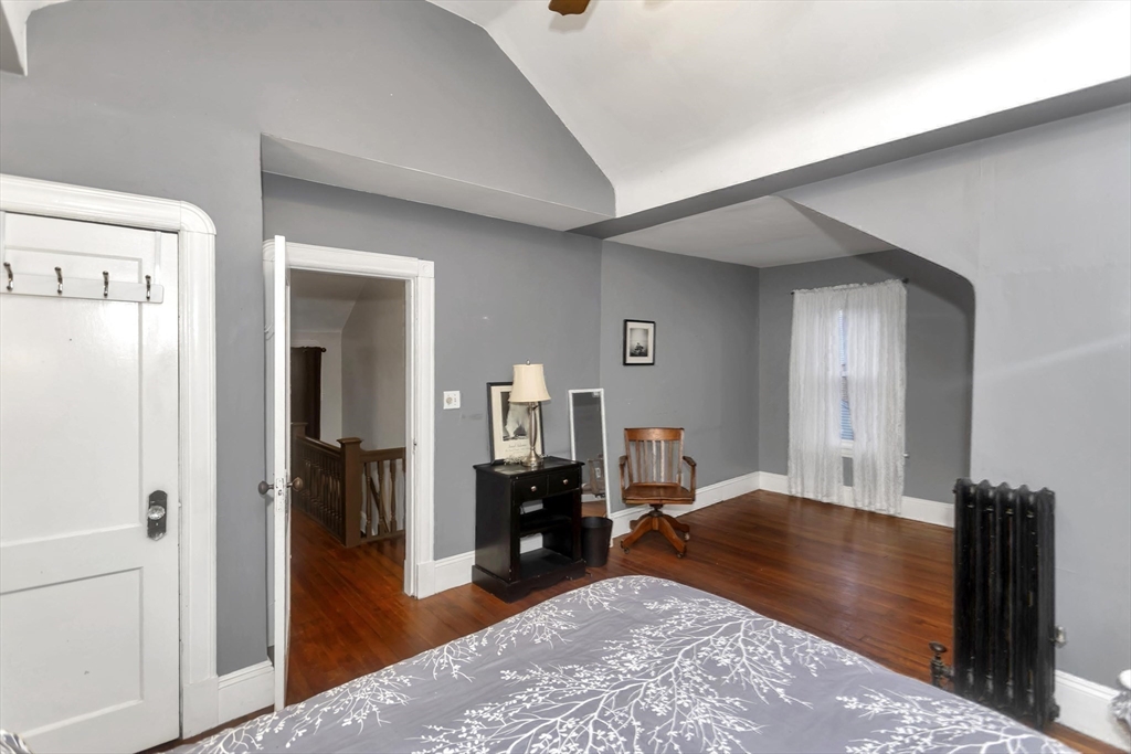 231 Wheatland Avenue Chicopee, MA 01020 - Photo 20 of 36 a living room with furniture and a wooden floor