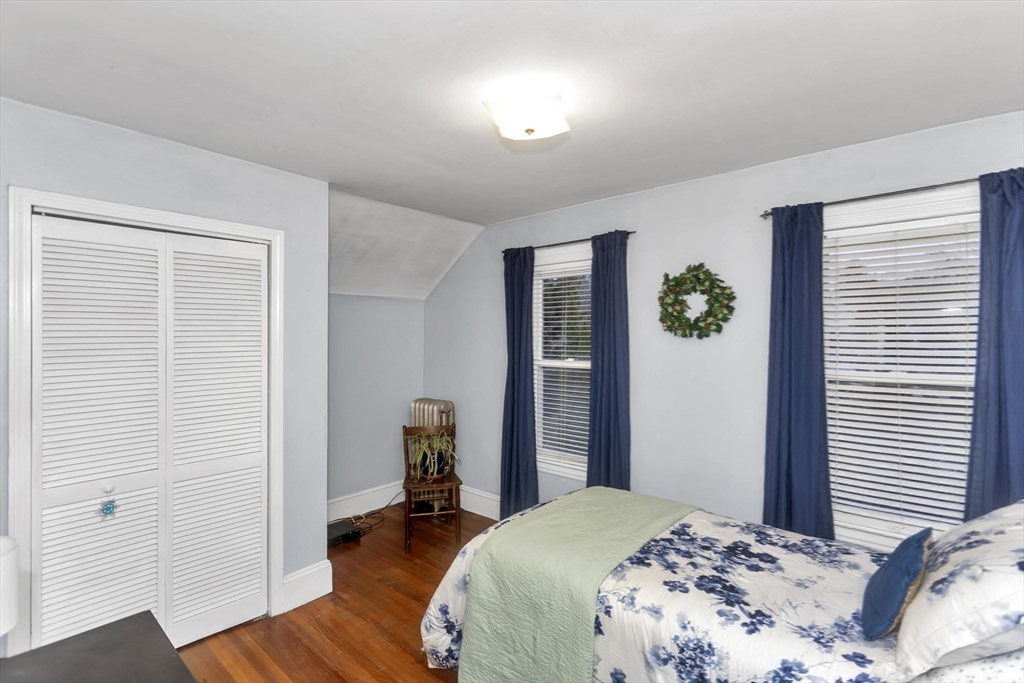 231 Wheatland Avenue Chicopee, MA 01020 - Photo 23 of 36 a bedroom with a bed and a window