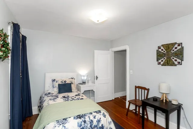 a bedroom with a bed and a table in it