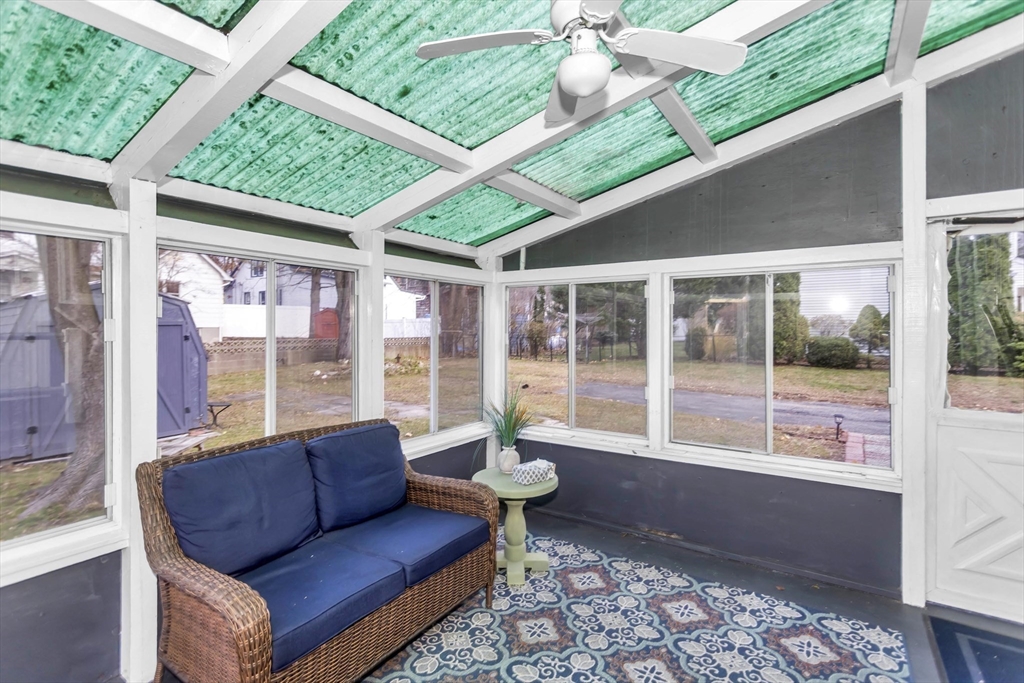231 Wheatland Avenue Chicopee, MA 01020 - Photo 32 of 36 a living room with furniture and a floor to ceiling window