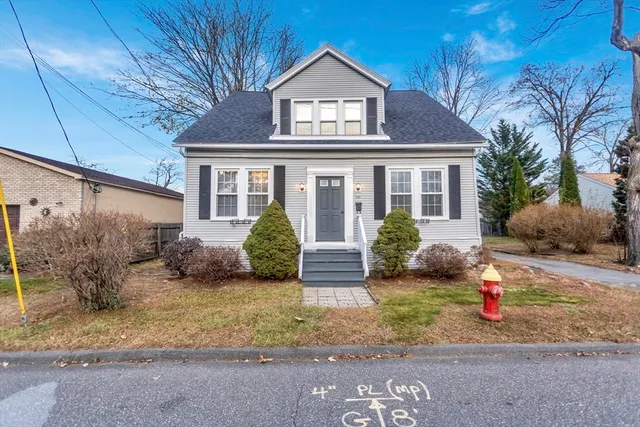 a view of a house with a yard and plants