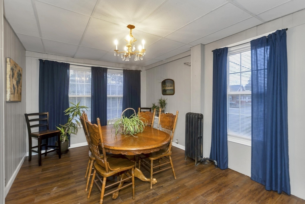 231 Wheatland Avenue Chicopee, MA 01020 - Photo 7 of 36 a view of a dining room with furniture and chandelier