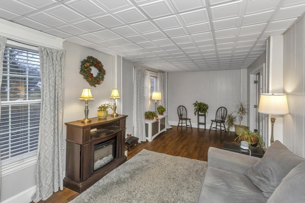 231 Wheatland Avenue Chicopee, MA 01020 - Photo 10 of 36 a living room with furniture and wooden floor