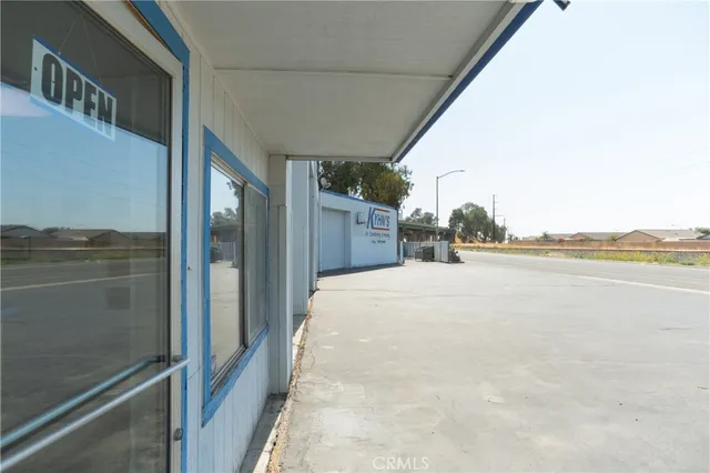 a room with furniture a rug and a window