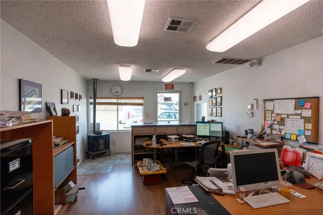 a living room with furniture pool table and window
