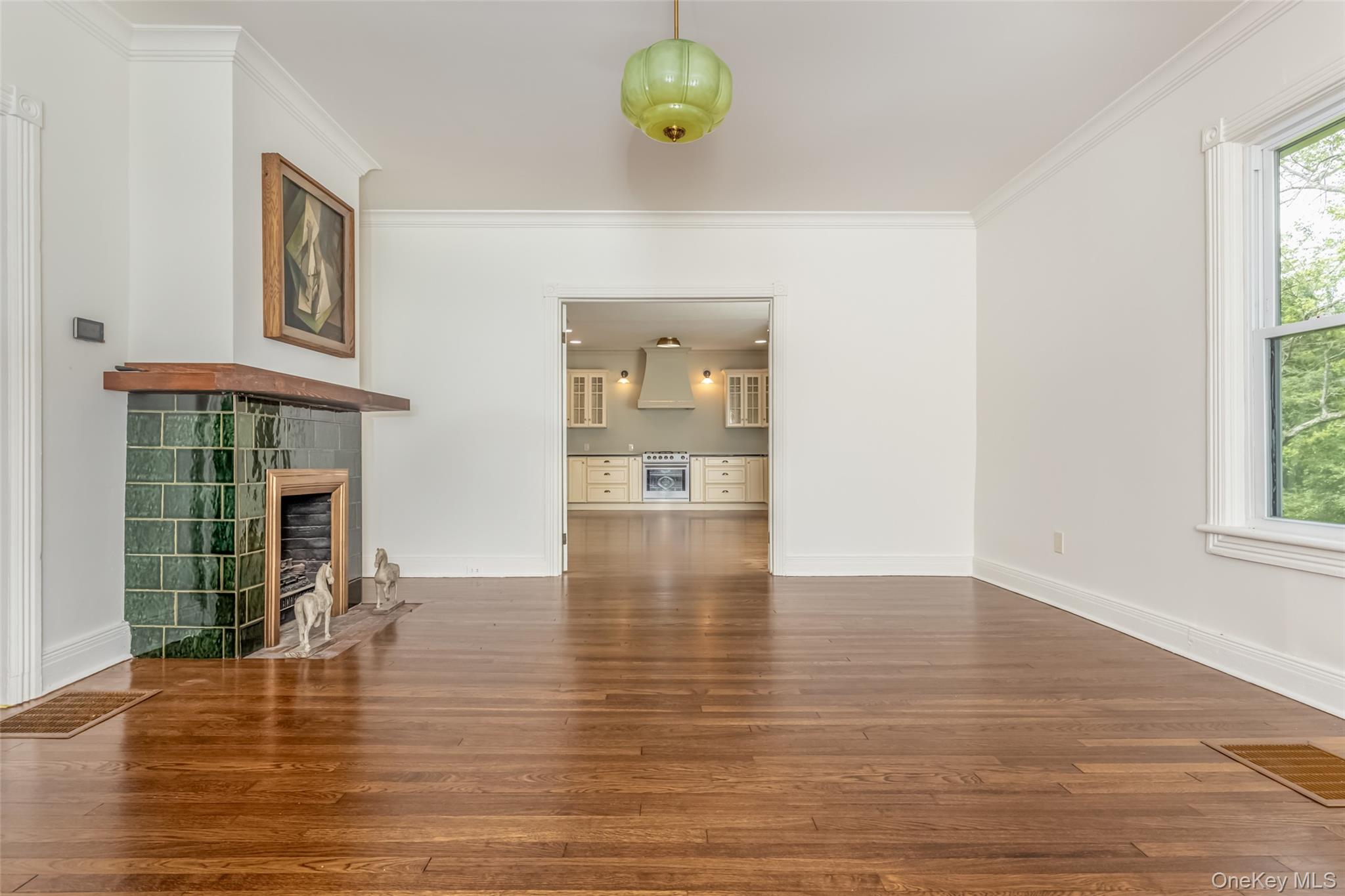 405 Vista Maria Road Cragsmoor, NY 12566 - Photo 11 of 35 a view of an empty room with window and wooden floor