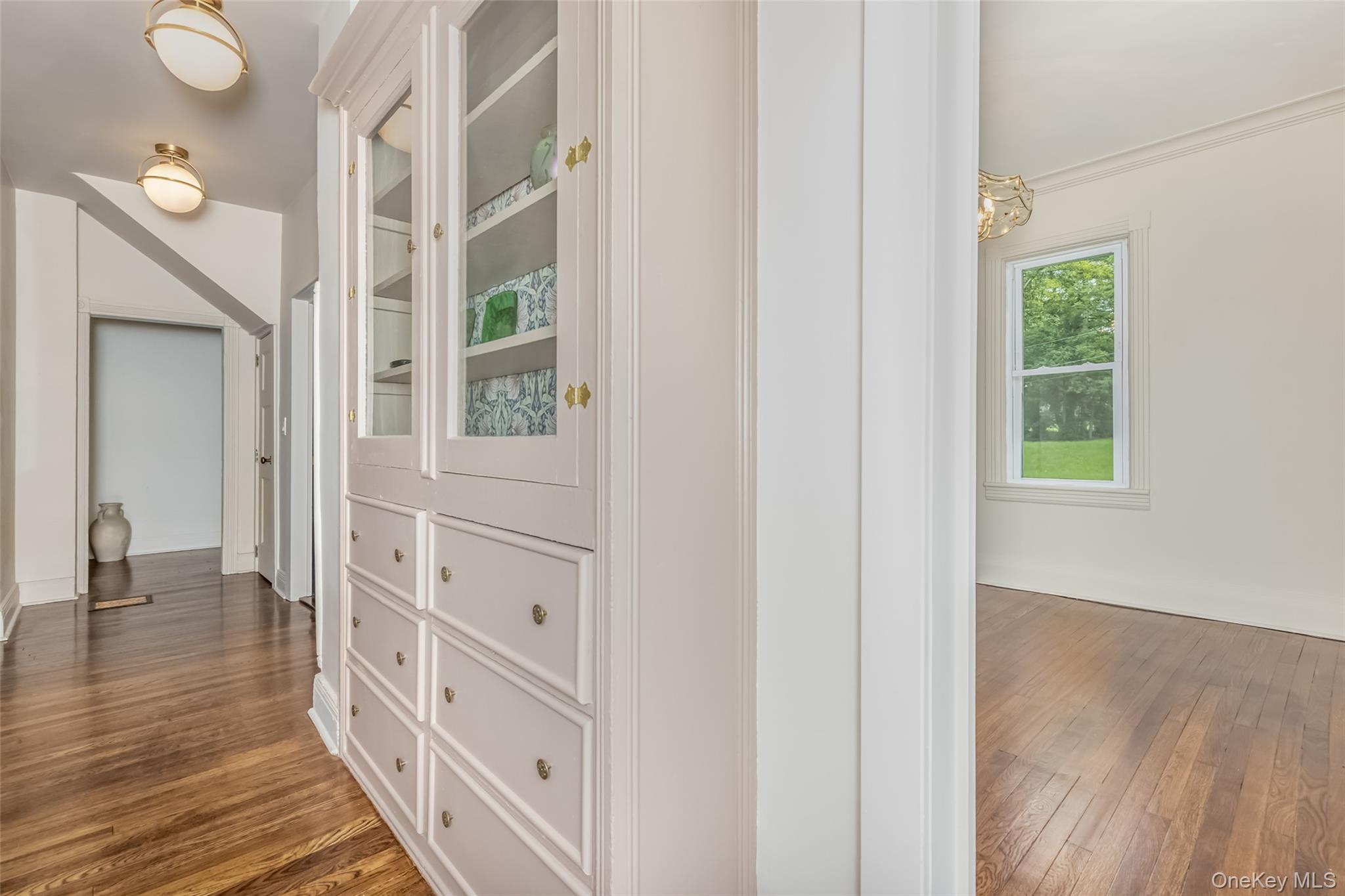 405 Vista Maria Road Cragsmoor, NY 12566 - Photo 19 of 35 a view of a hallway with wooden floor and windows