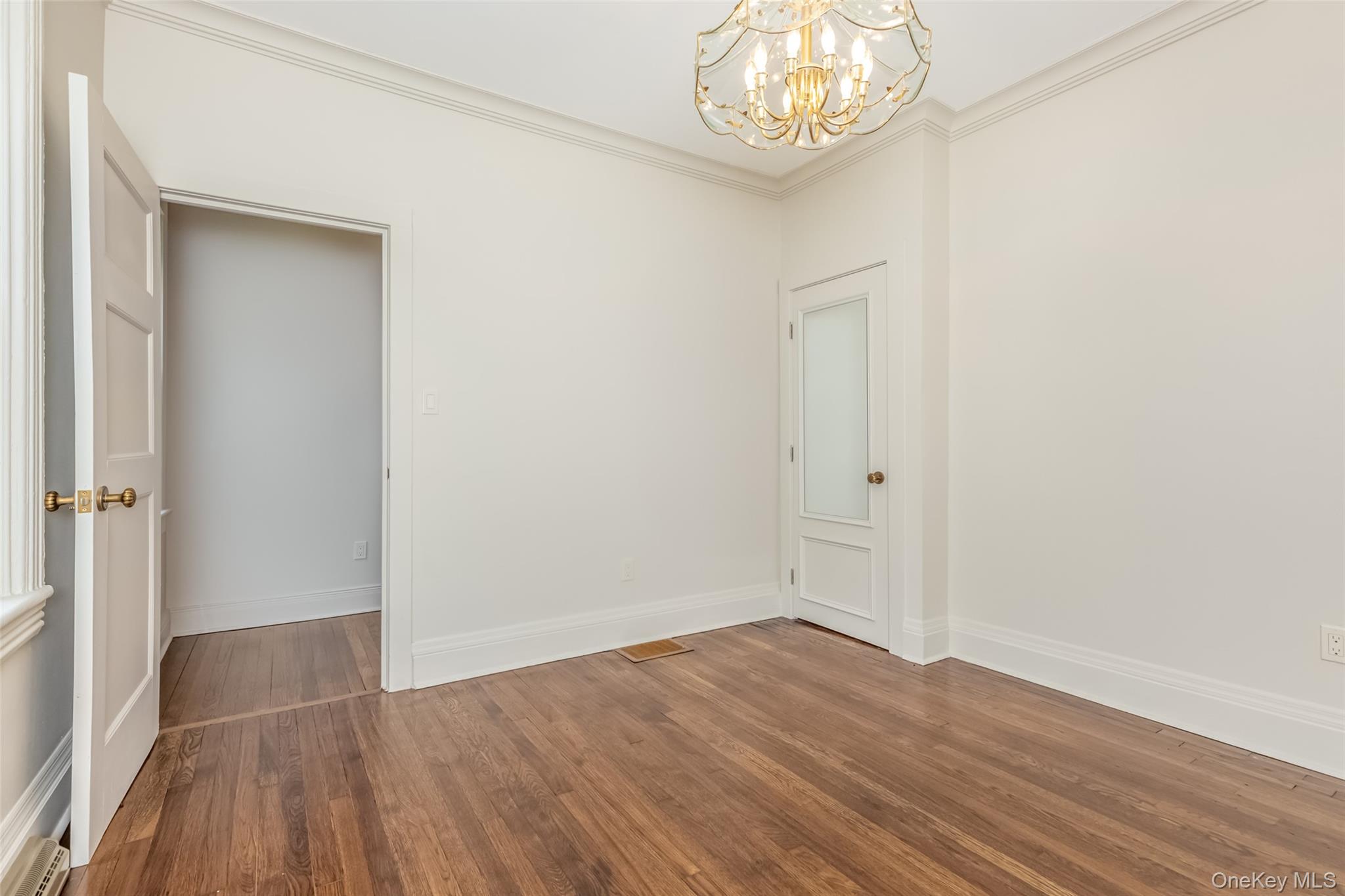 405 Vista Maria Road Cragsmoor, NY 12566 - Photo 20 of 35 an empty room with wooden floor and a window