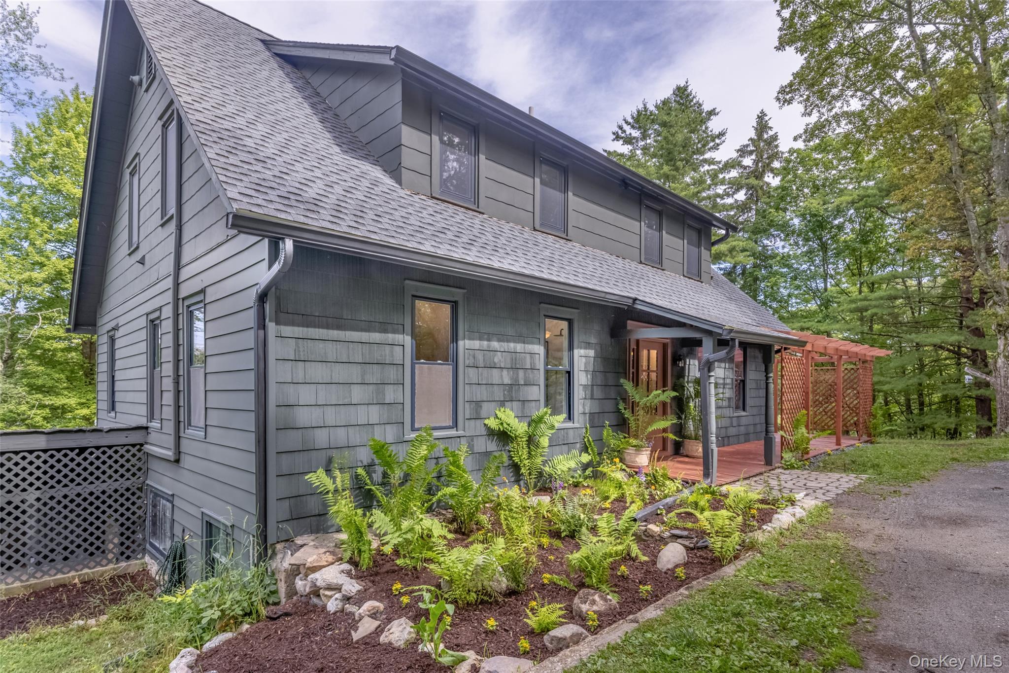 405 Vista Maria Road Cragsmoor, NY 12566 - Photo 22 of 35 a front view of a house with garden