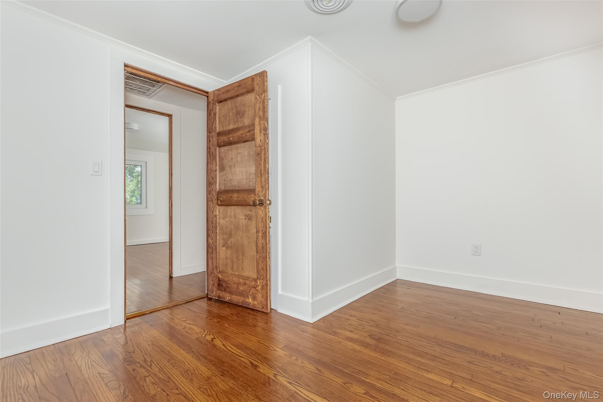 405 Vista Maria Road Cragsmoor, NY 12566 - Photo 30 of 35 an empty room with wooden floor and closet