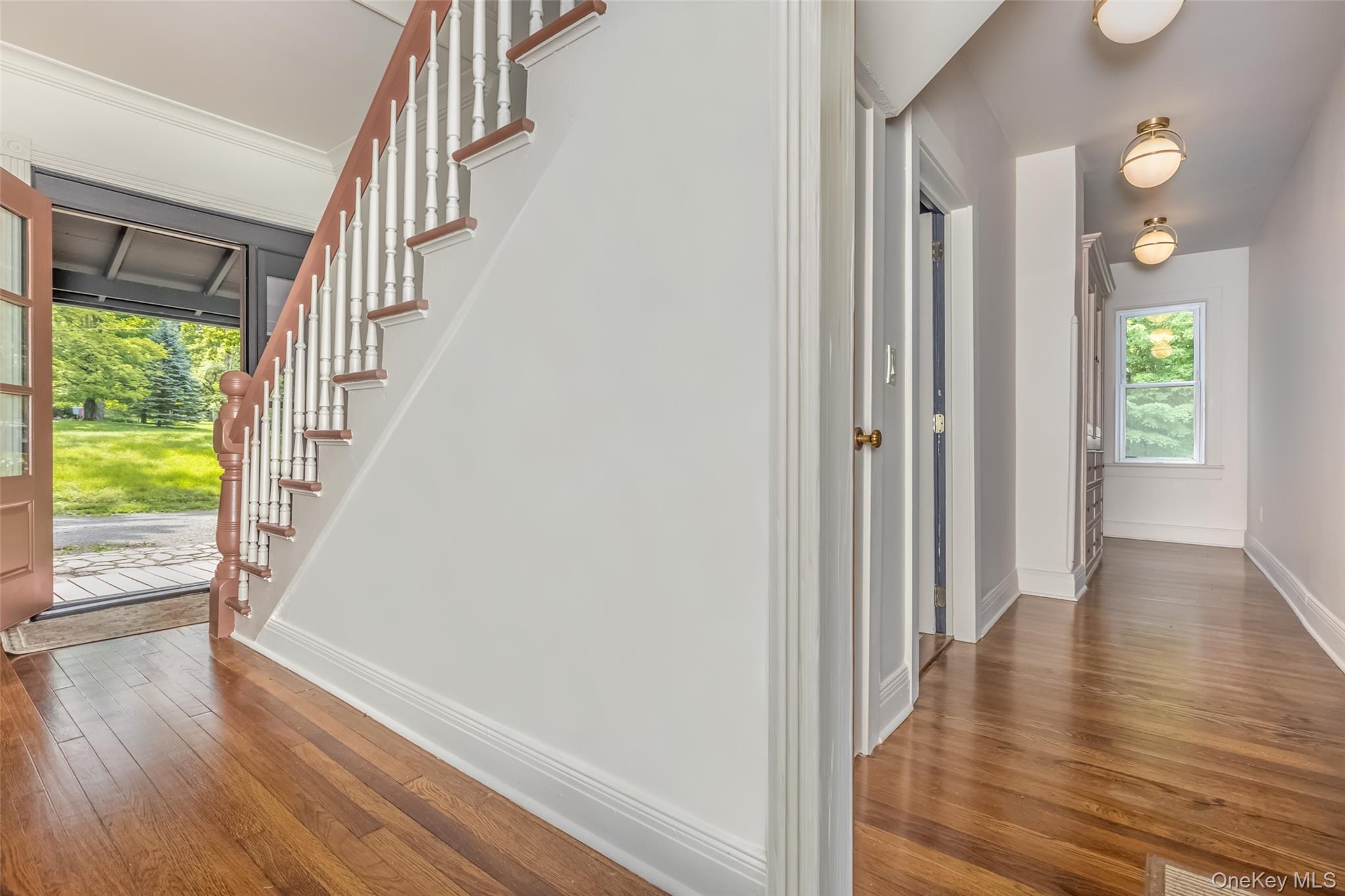 405 Vista Maria Road Cragsmoor, NY 12566 - Photo 5 of 35 a view of a hallway with wooden floor and stairs
