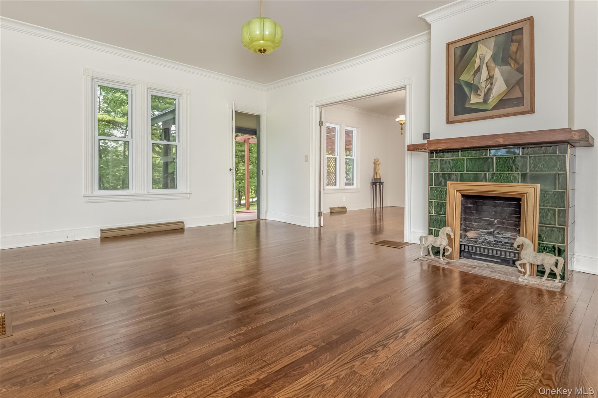 405 Vista Maria Road Cragsmoor, NY 12566 - Photo 9 of 35 a view of an empty room with wooden floor and a window