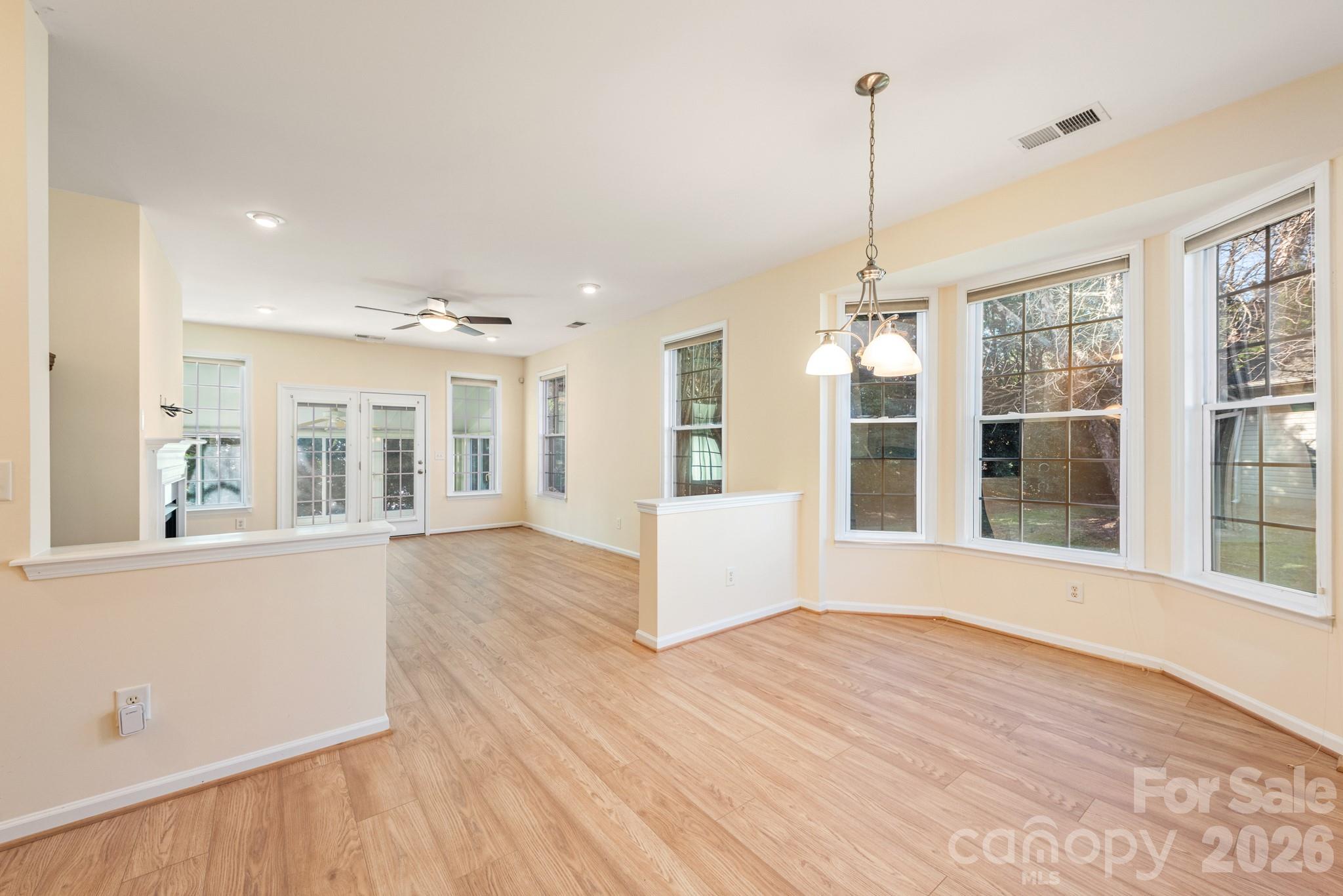 2013 Citron Avenue Fort Mill, SC 29708 - Photo 11 of 34 a view of an empty room with wooden floor and a window