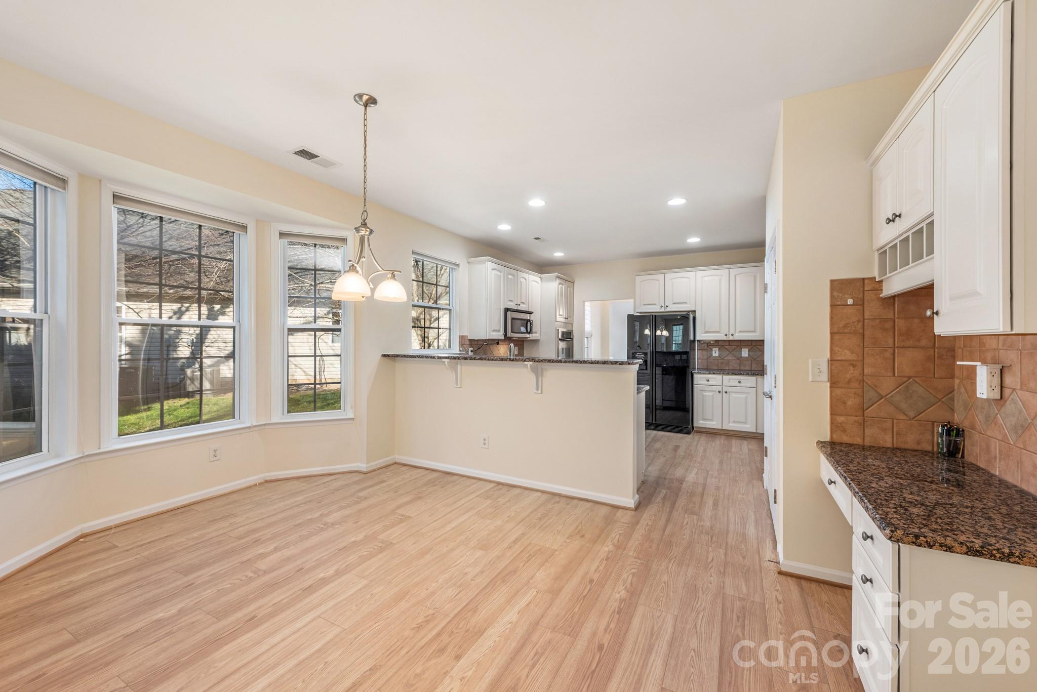 2013 Citron Avenue Fort Mill, SC 29708 - Photo 16 of 34 a view of kitchen with cabinets and wooden floor