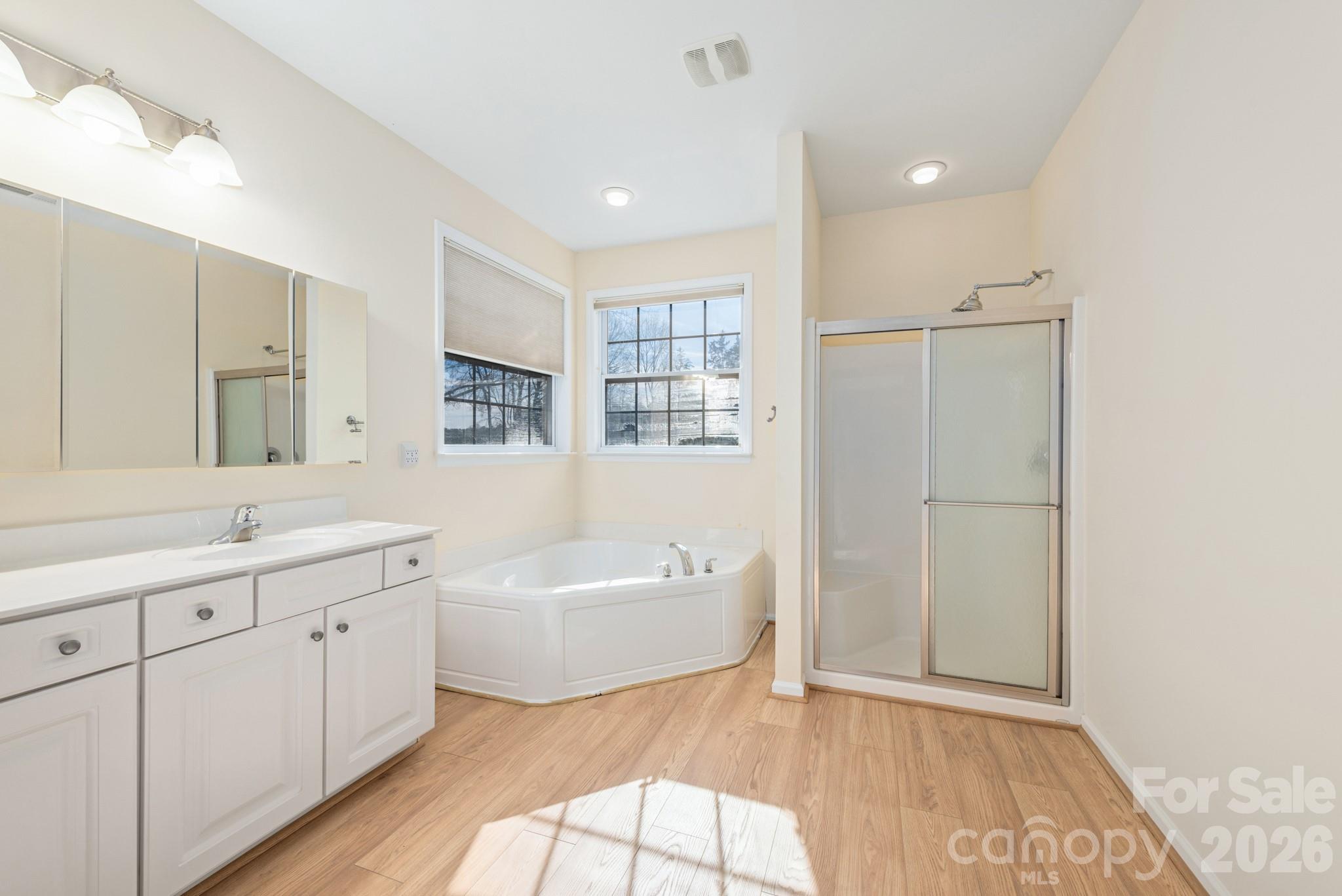 2013 Citron Avenue Fort Mill, SC 29708 - Photo 20 of 34 a spacious bathroom with a double vanity sink a mirror and a bathtub