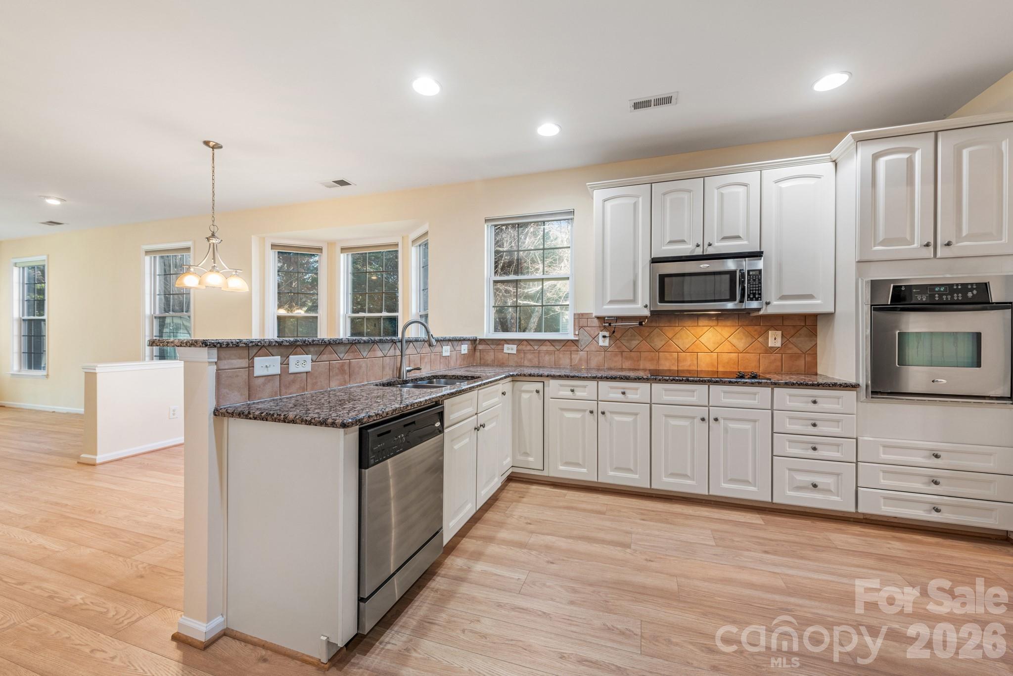2013 Citron Avenue Fort Mill, SC 29708 - Photo 9 of 34 a large kitchen with granite countertop a stove and a sink