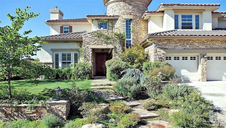12428 Palmer Drive Moorpark, CA 93021 - Photo 2 of 42 a front view of a house with a yard