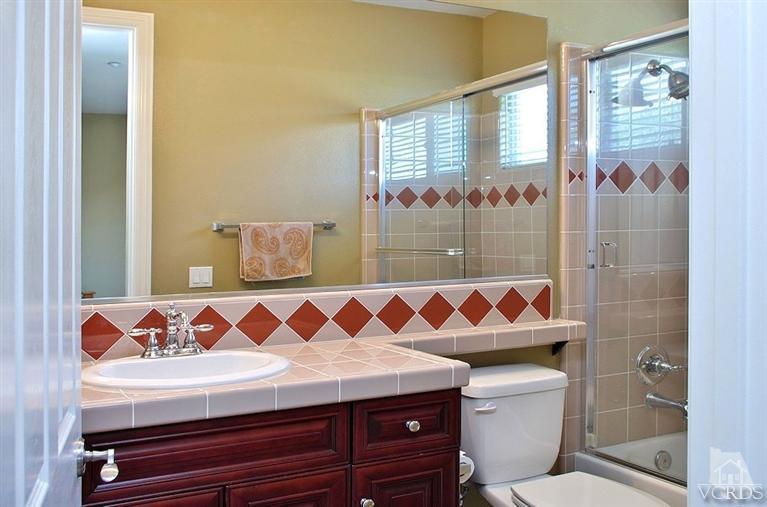 12428 Palmer Drive Moorpark, CA 93021 - Photo 18 of 42 a bathroom with a sink and a mirror