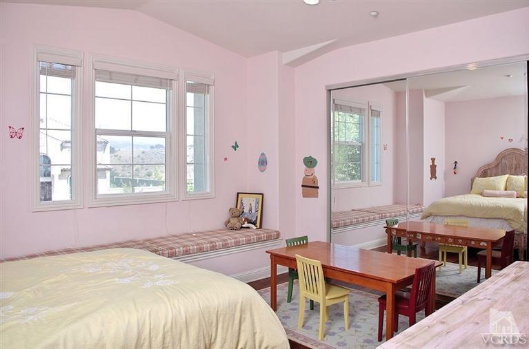 12428 Palmer Drive Moorpark, CA 93021 - Photo 19 of 42 a bedroom with a bed and wooden floor