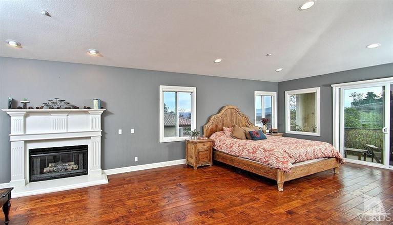 12428 Palmer Drive Moorpark, CA 93021 - Photo 20 of 42 a bedroom with a bed and a fireplace