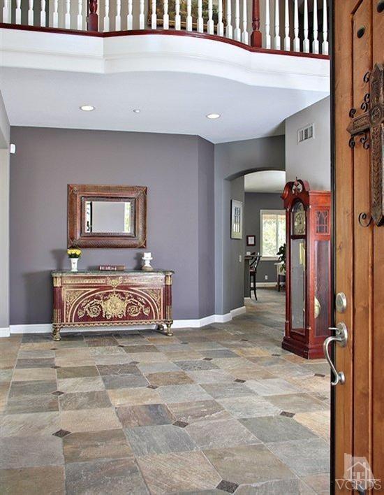 12428 Palmer Drive Moorpark, CA 93021 - Photo 3 of 42 a bedroom with a bed and a chandelier