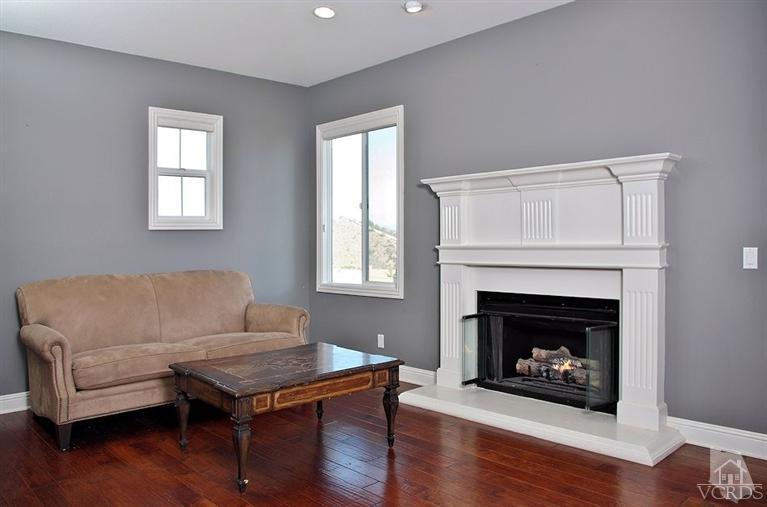 12428 Palmer Drive Moorpark, CA 93021 - Photo 22 of 42 a living room with furniture and a fireplace
