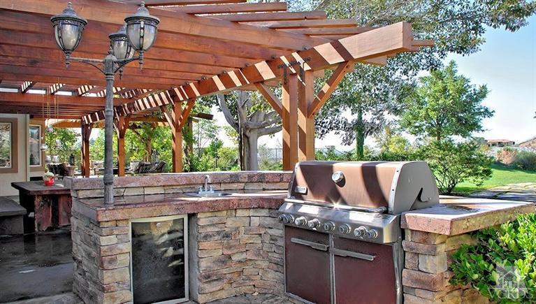 12428 Palmer Drive Moorpark, CA 93021 - Photo 33 of 42 a view of an outdoor sitting area with brick walls