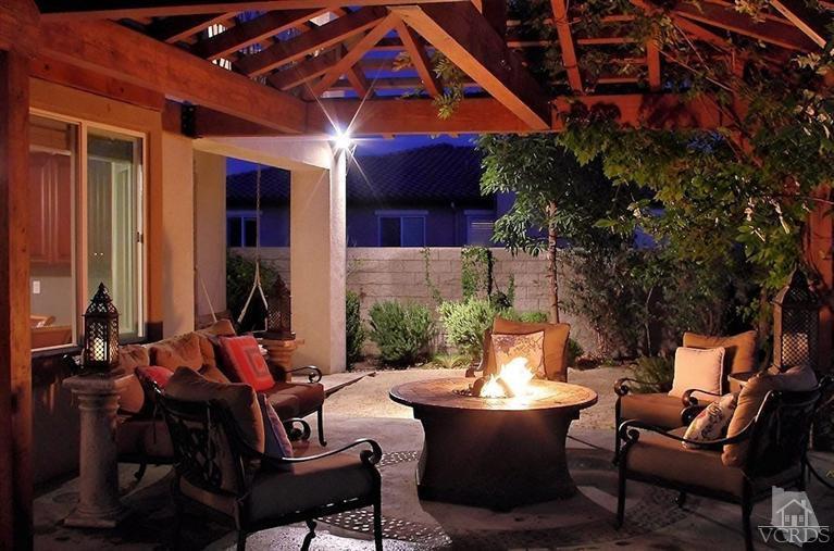 12428 Palmer Drive Moorpark, CA 93021 - Photo 38 of 42 a view of a patio with couches table and chairs and potted plants