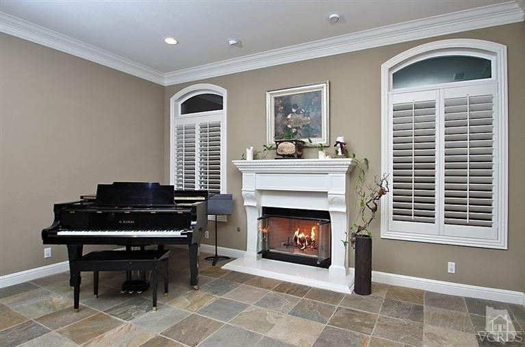 12428 Palmer Drive Moorpark, CA 93021 - Photo 5 of 42 a living room with furniture a fireplace and a window