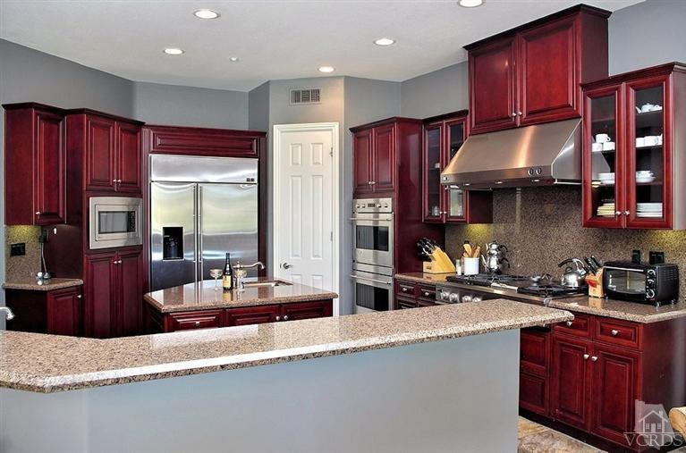 12428 Palmer Drive Moorpark, CA 93021 - Photo 9 of 42 a kitchen with stainless steel appliances granite countertop a sink refrigerator and cabinets