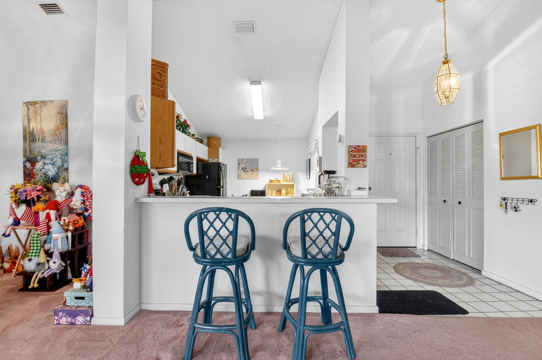3227 Perimeter Drive Greenacres, FL 33467 - Photo 14 of 57 a view of dining room and livingroom with furniture wooden floor a chandelier